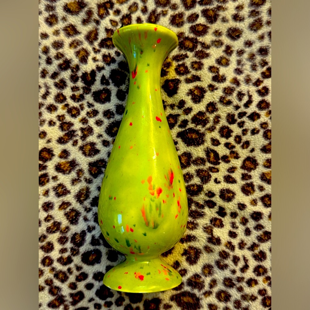 Vintage vase.Green with speckles of orange and red.One chip and a few scratches.